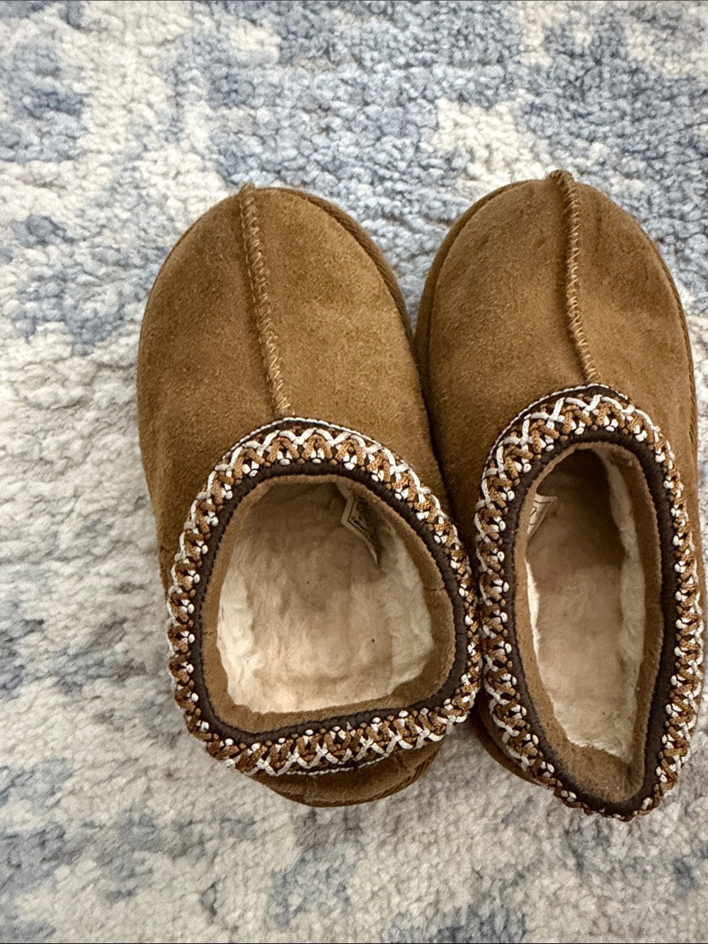 UGG toddler’s Chestnut Brown Faux-Suede Slip-On Slippers with Braided Trim